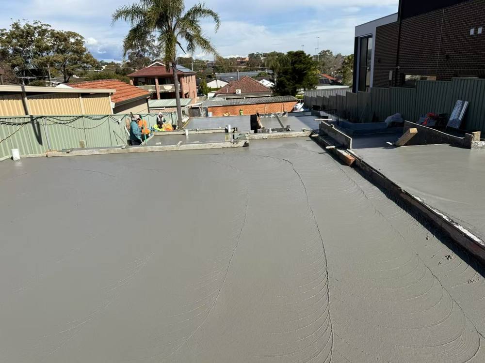 Freshly poured and finished concrete slab on a residential site